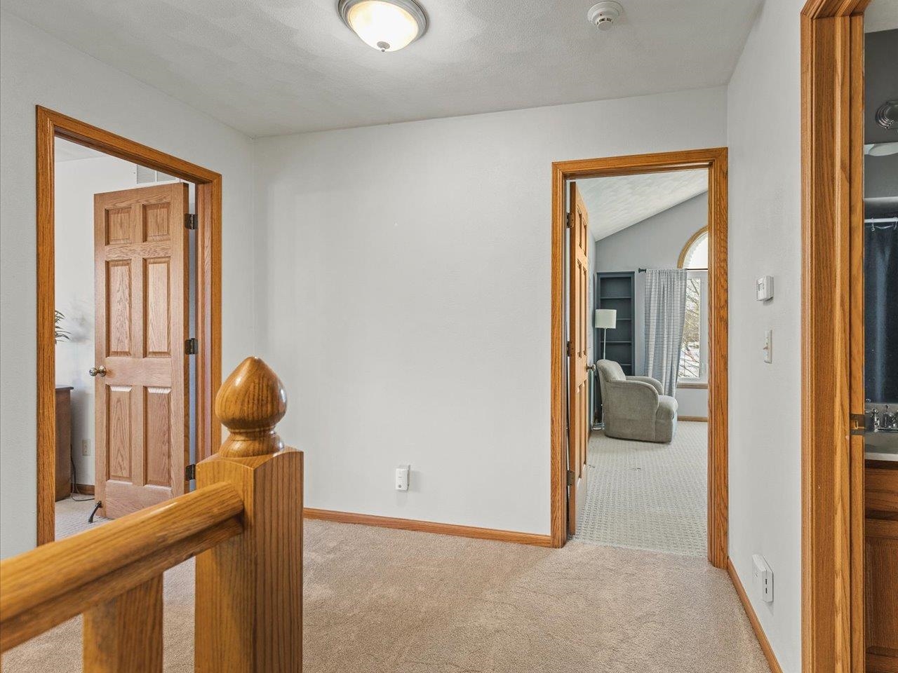 12375 Wildflower Lane Belvidere, IL 61008 - Photo 28 of 52 a view of a hallway to a livingroom and a dining room with a mirror