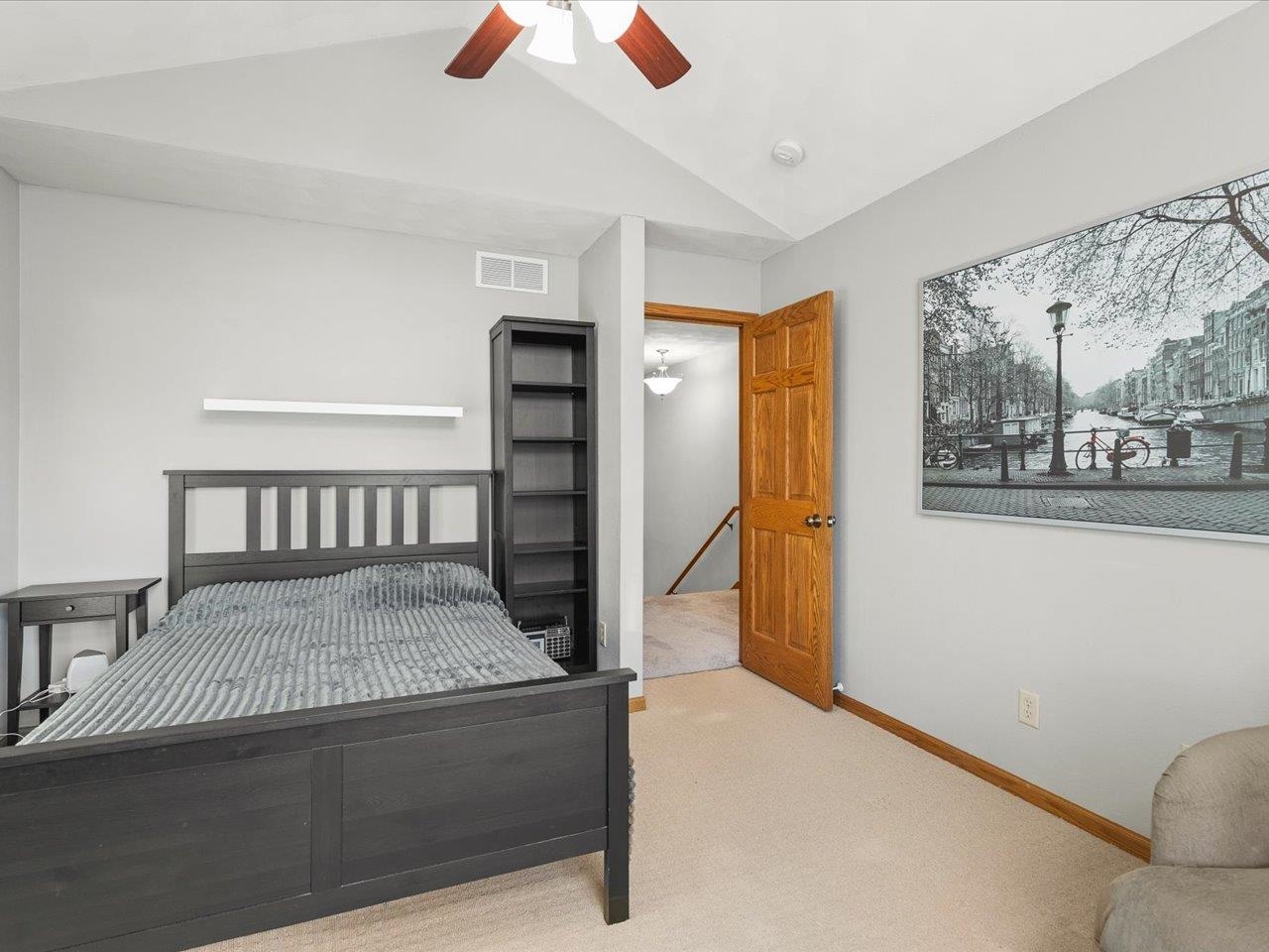 12375 Wildflower Lane Belvidere, IL 61008 - Photo 29 of 52 a bedroom with a bed and wooden floor