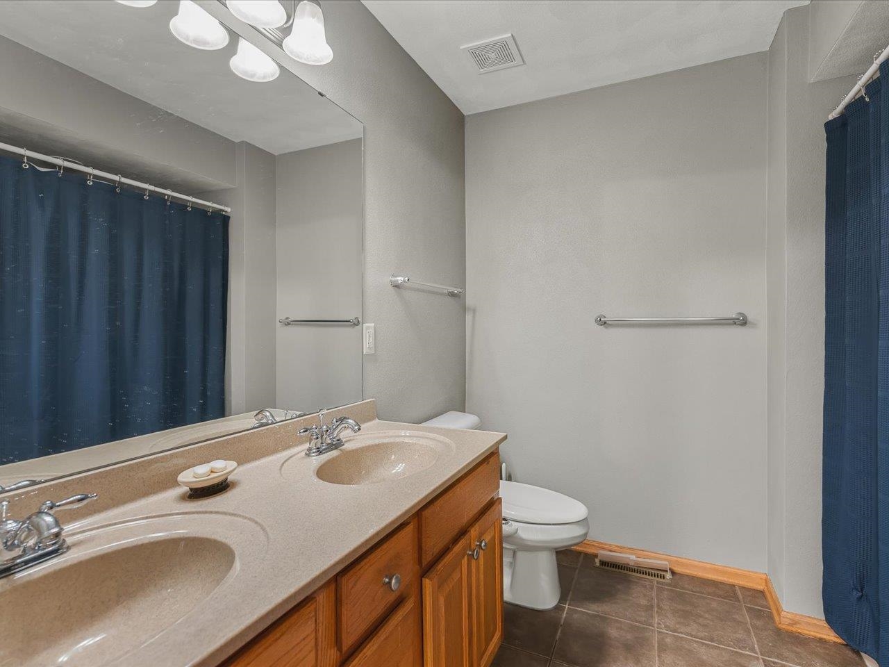 12375 Wildflower Lane Belvidere, IL 61008 - Photo 31 of 52 a bathroom with a granite countertop sink toilet and shower