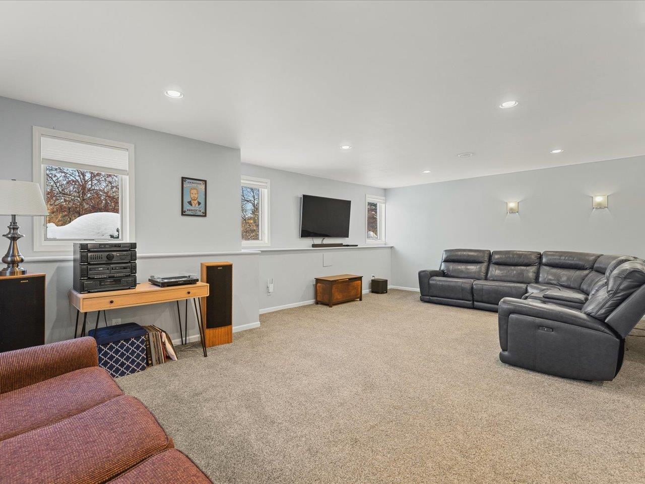 12375 Wildflower Lane Belvidere, IL 61008 - Photo 37 of 52 a living room with furniture and a flat screen tv