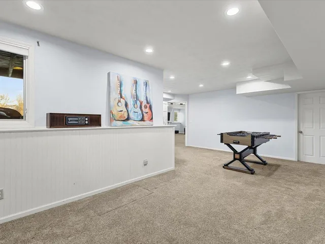 a living room with furniture and a rug