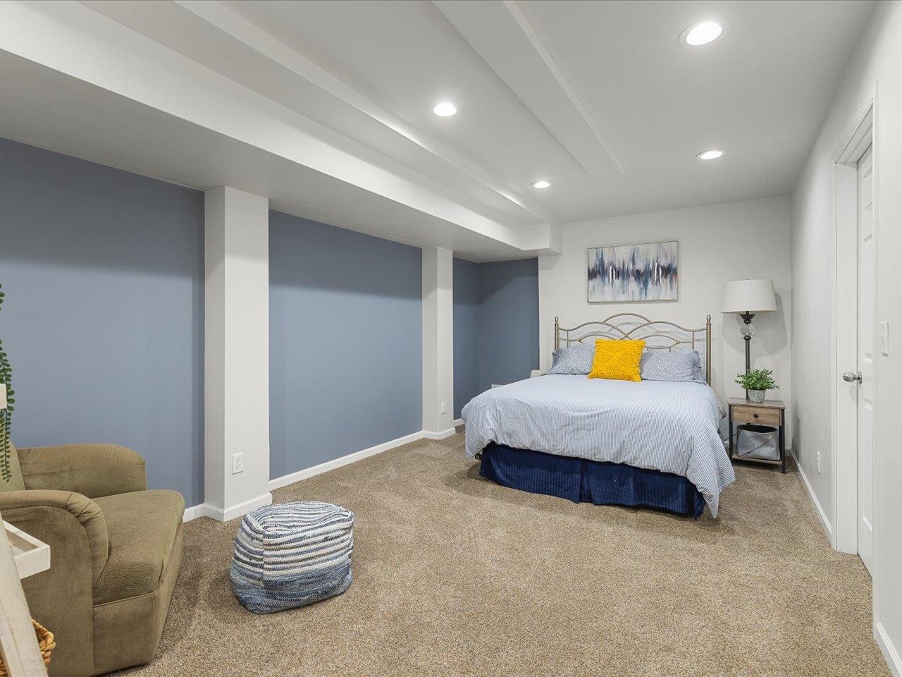 12375 Wildflower Lane Belvidere, IL 61008 - Photo 42 of 52 a spacious bedroom with a bed and a couch