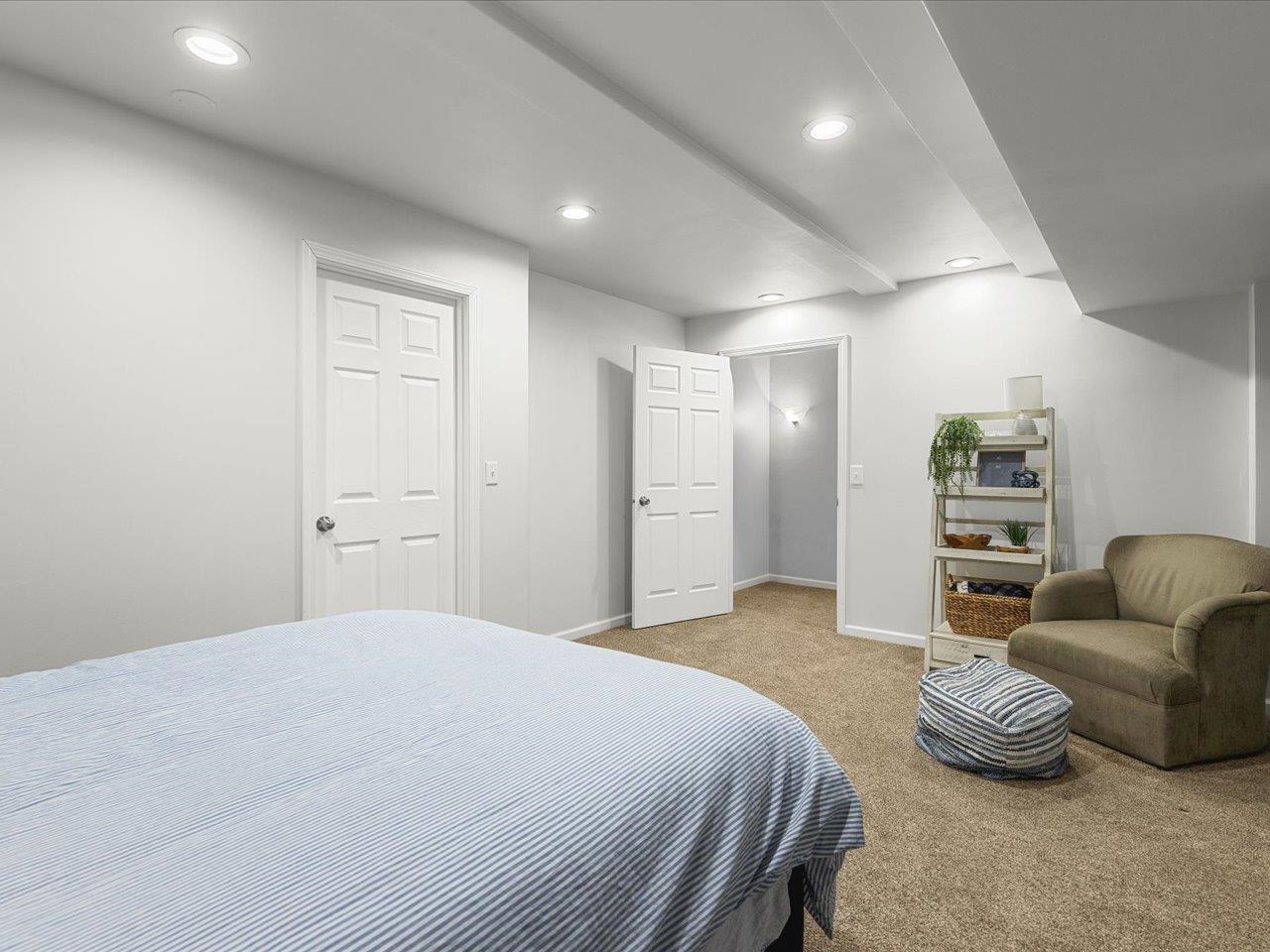 12375 Wildflower Lane Belvidere, IL 61008 - Photo 44 of 52 a spacious bedroom with a bed and furniture