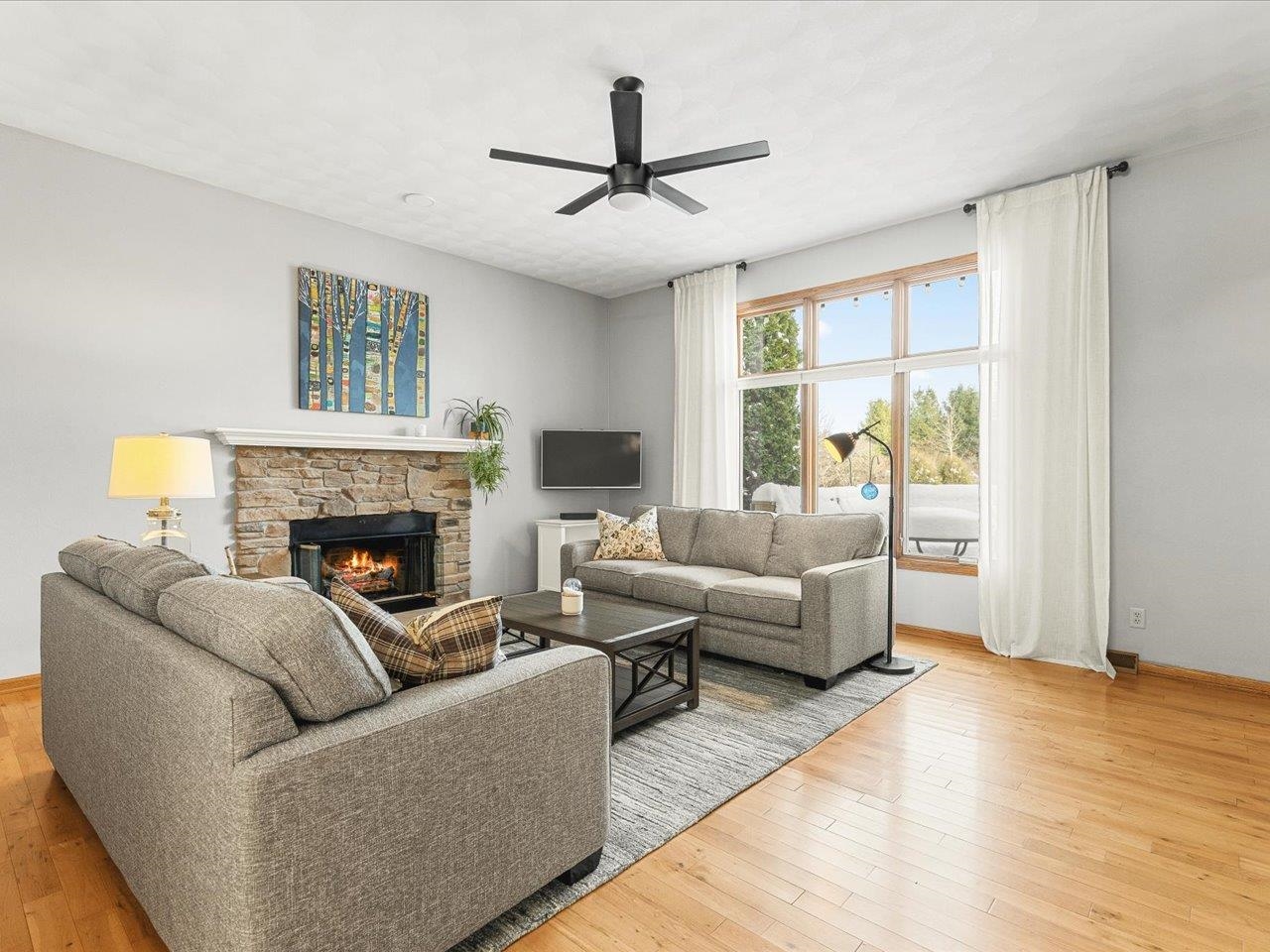 12375 Wildflower Lane Belvidere, IL 61008 - Photo 6 of 52 a living room with furniture and a fireplace