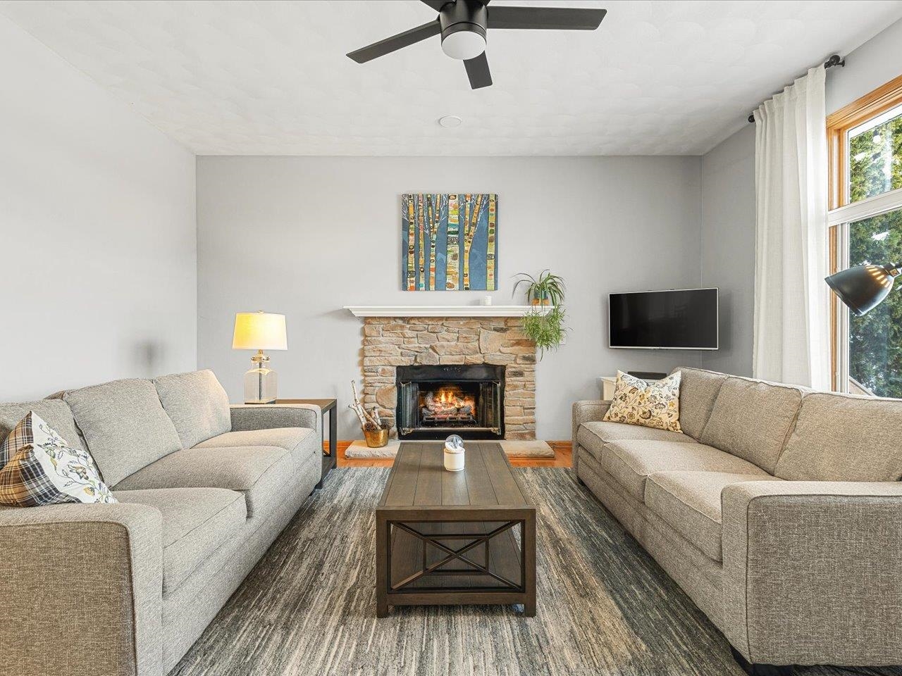 12375 Wildflower Lane Belvidere, IL 61008 - Photo 7 of 52 a living room with furniture and a fireplace