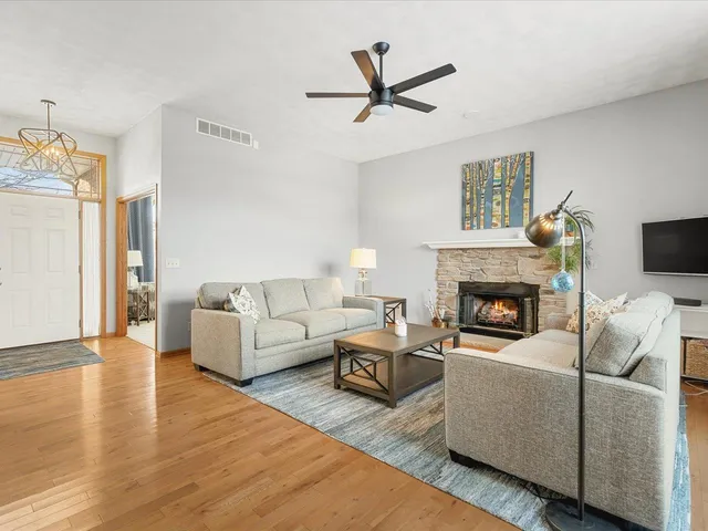 a living room with furniture and a fireplace