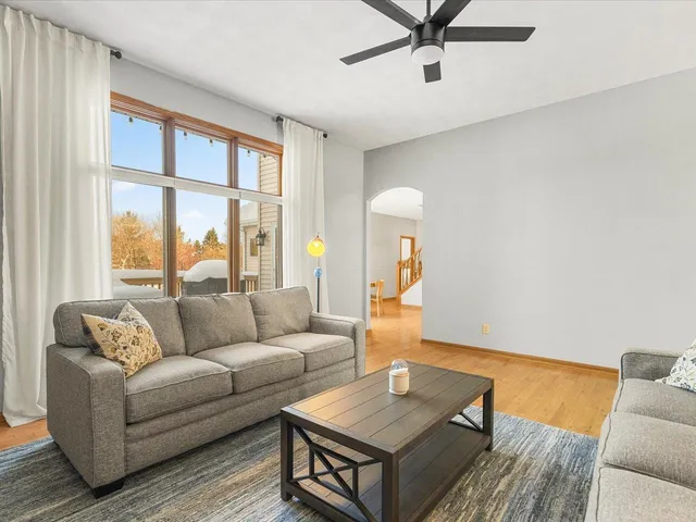 a living room with furniture and a window