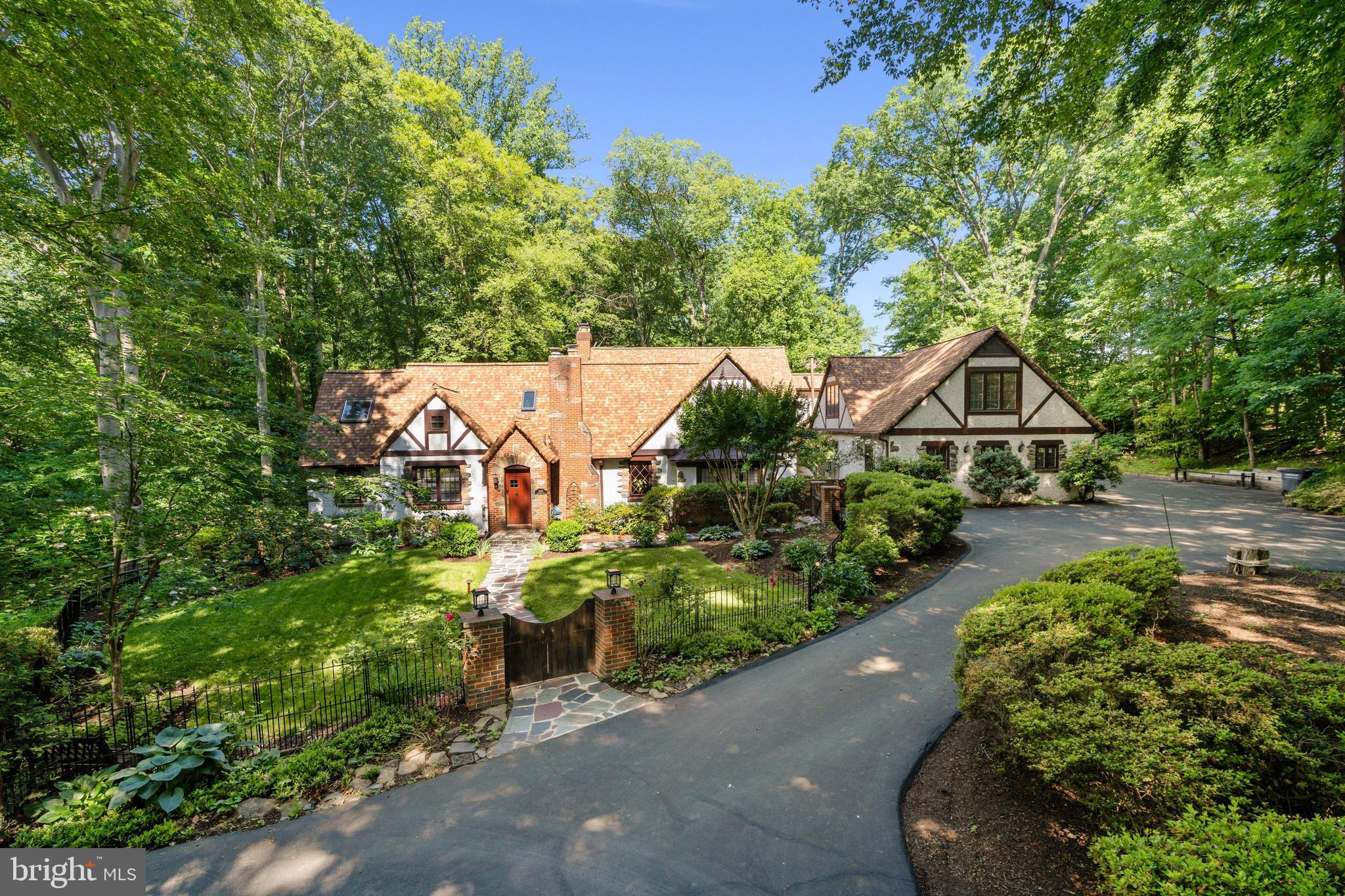 Storybook Tudor with a private compound  feel