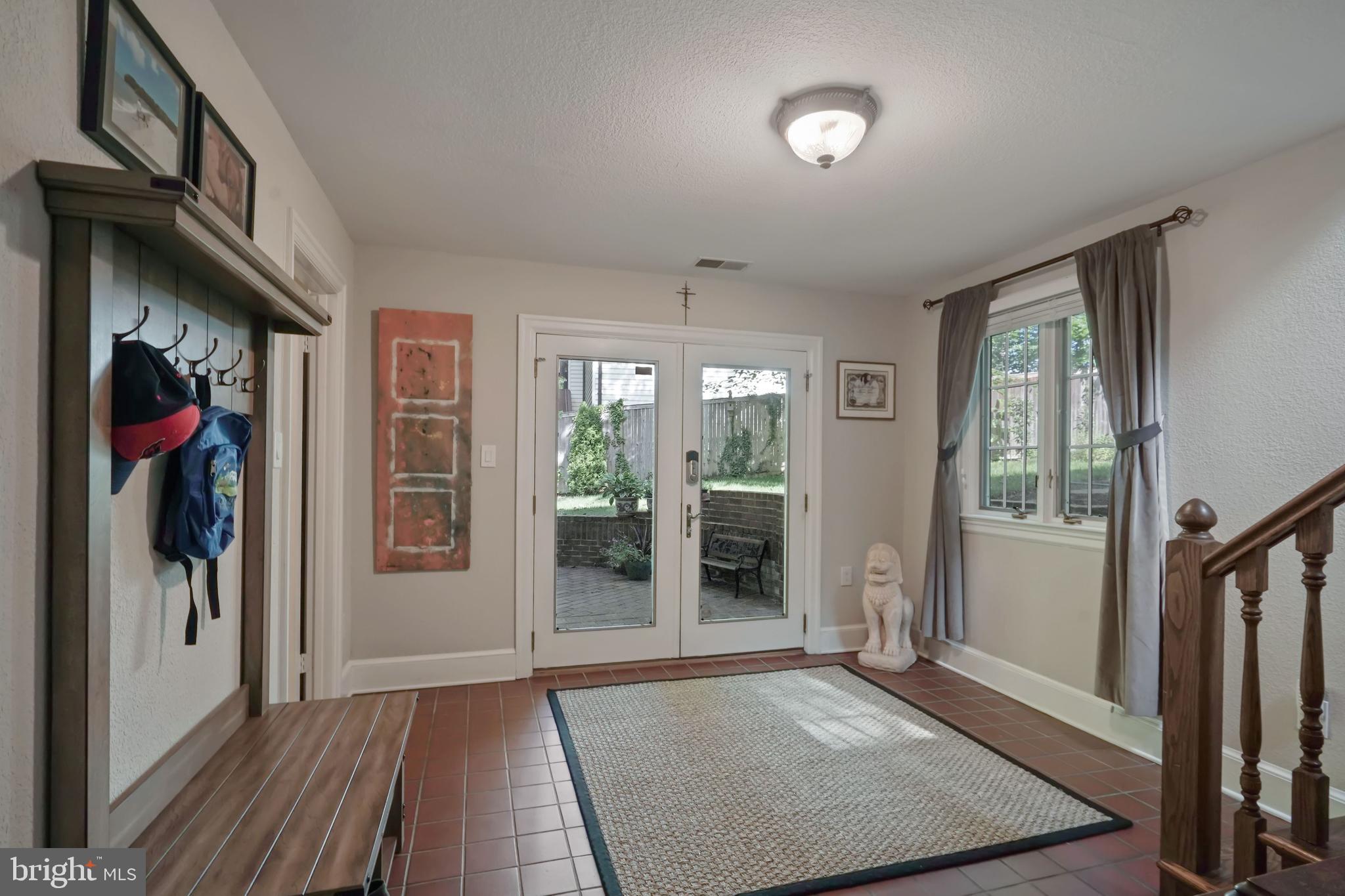 6580 Braddock Road Alexandria, VA 22312 - Photo 28 of 50 Terra cotta tile in mudroom, laundry & great room