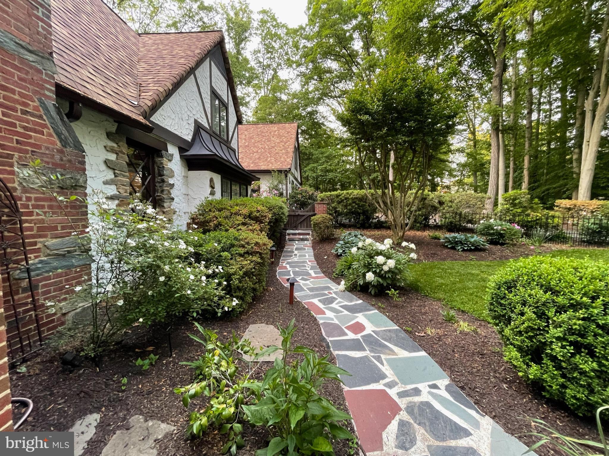 Privacy focused plantings and fenced front yard.