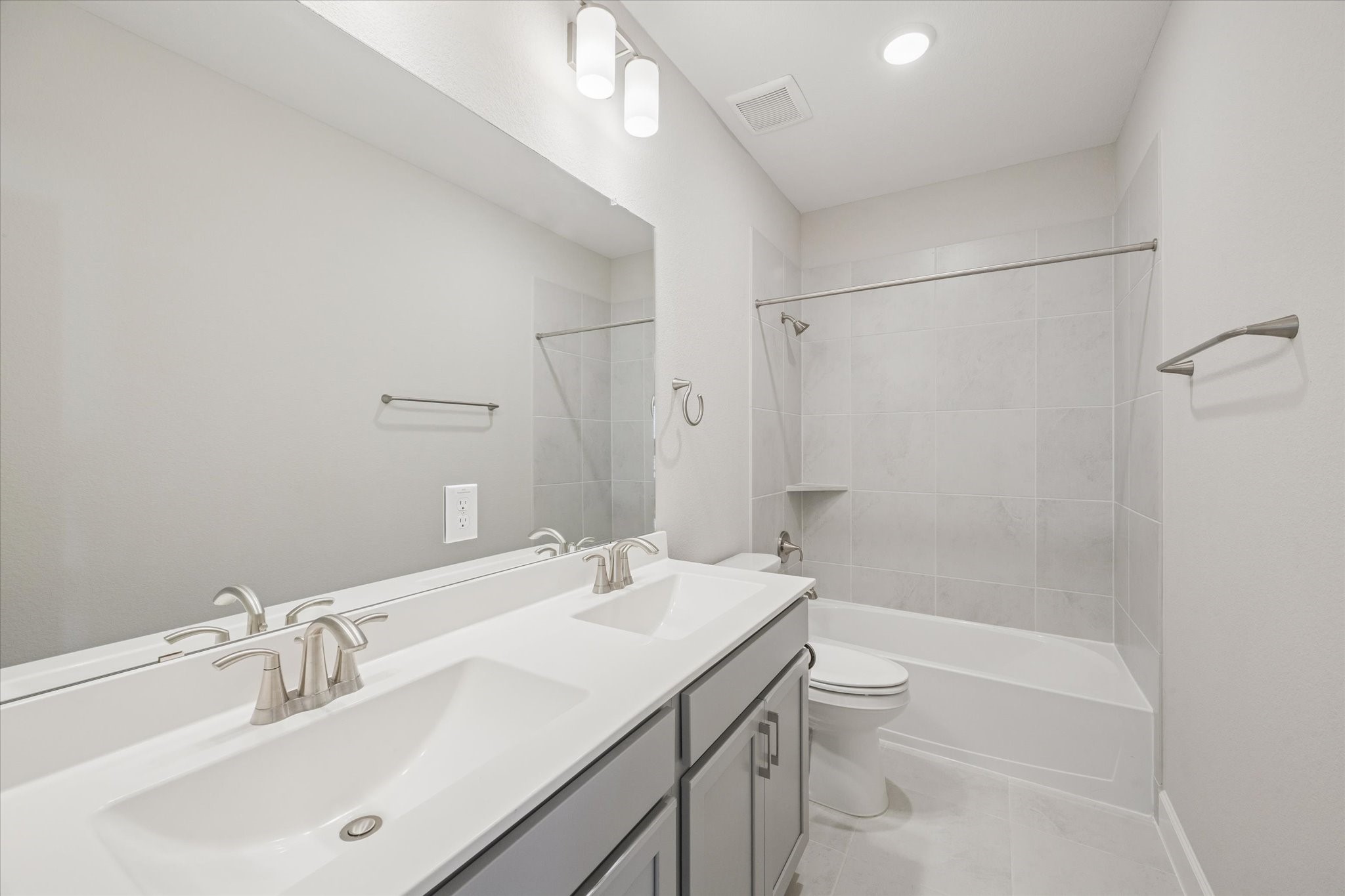 5518 Kindle Alley Manvel, TX 77578 - Photo 17 of 20 a bathroom with a sink a toilet and shower