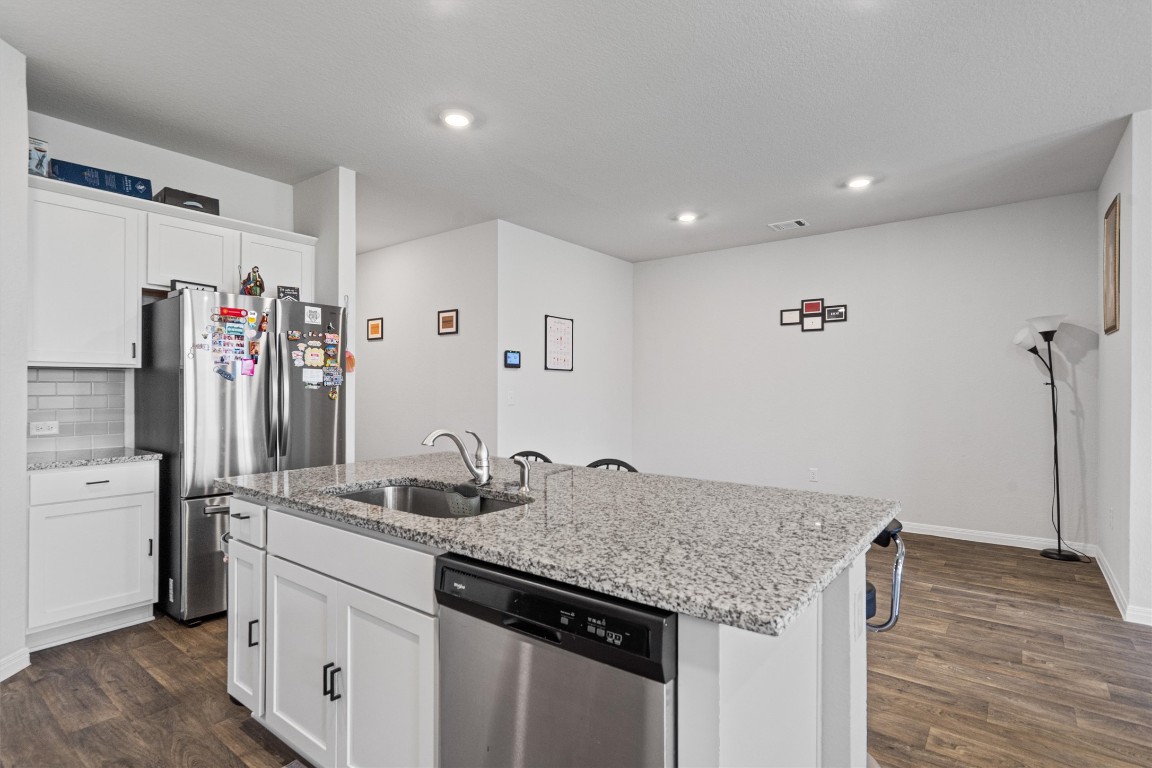 204 Connor Lane Georgetown, TX 78626 - Photo 13 of 31 a kitchen with stainless steel appliances granite countertop a sink and refrigerator