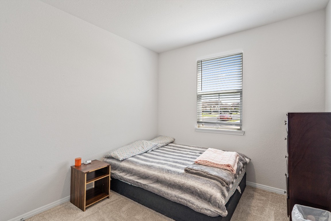 204 Connor Lane Georgetown, TX 78626 - Photo 18 of 31 a bedroom with a bed and a window