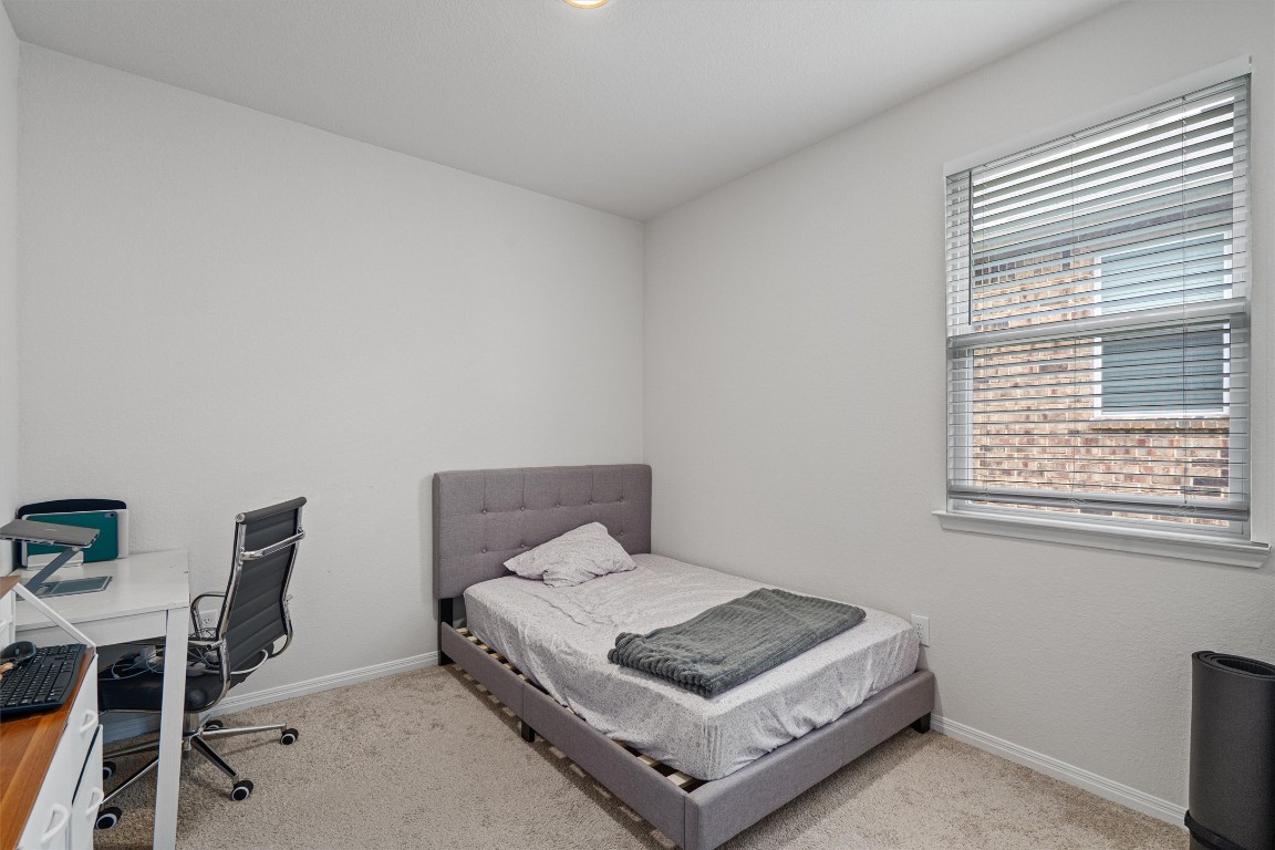 204 Connor Lane Georgetown, TX 78626 - Photo 21 of 31 a bedroom with a bed and a window