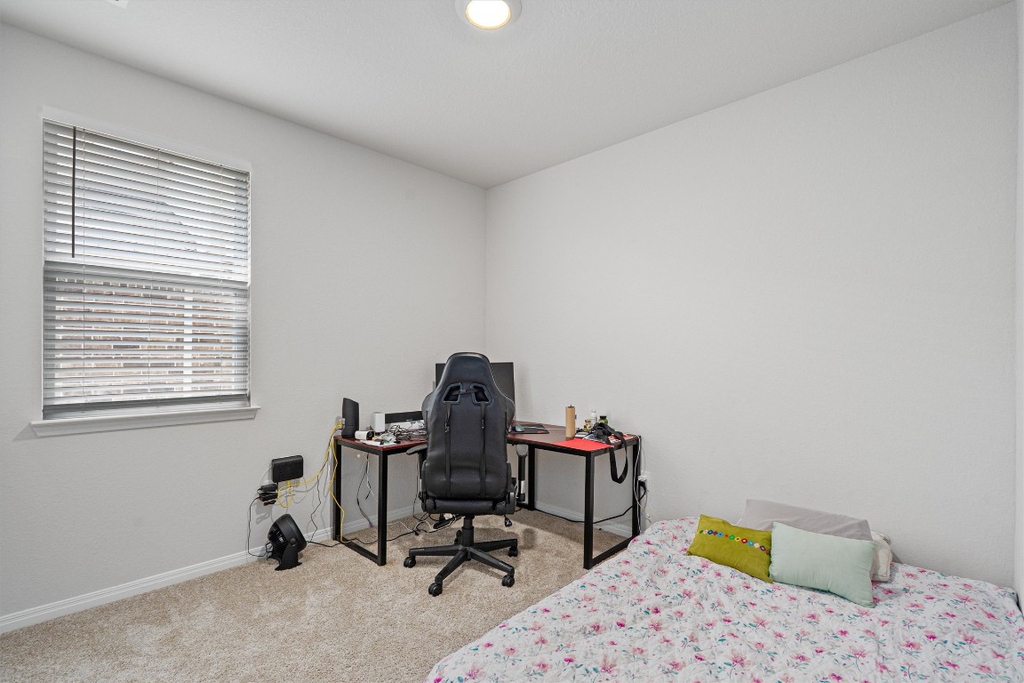 204 Connor Lane Georgetown, TX 78626 - Photo 24 of 31 a bedroom with a workspace