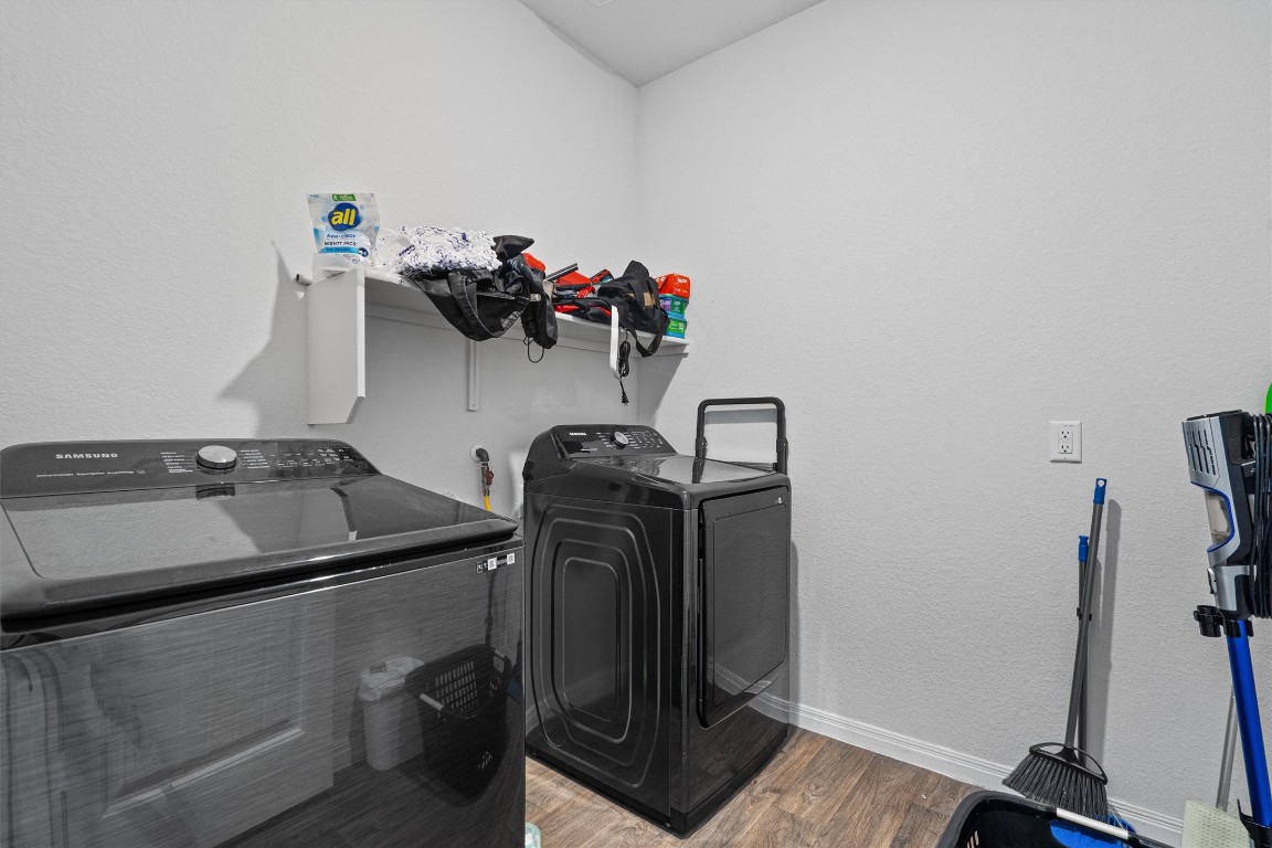 204 Connor Lane Georgetown, TX 78626 - Photo 26 of 31 a view of storage and utility room with two washing machine