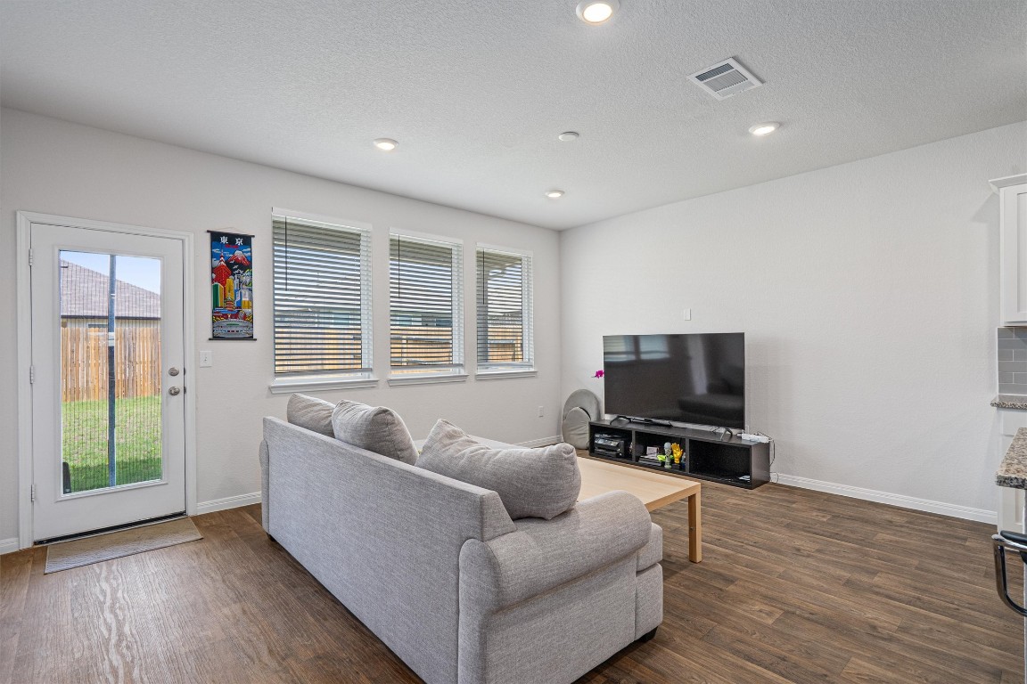 204 Connor Lane Georgetown, TX 78626 - Photo 6 of 31 a living room with furniture and a flat screen tv