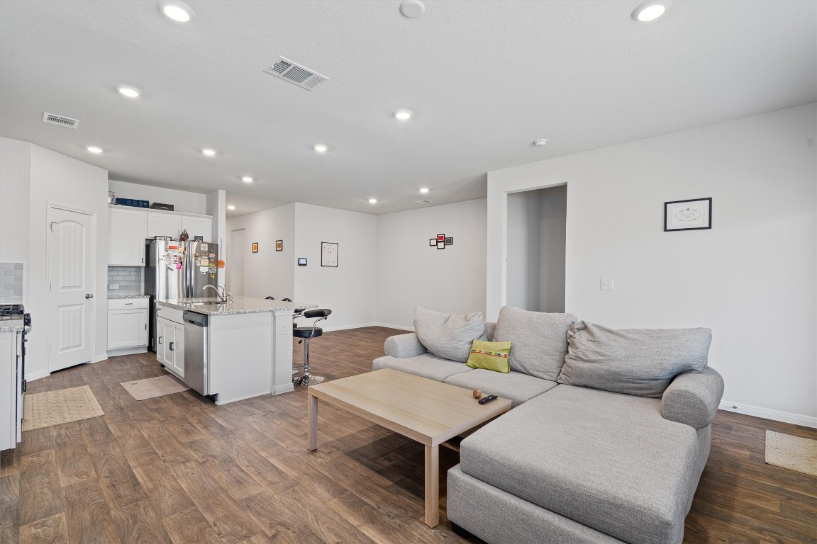 204 Connor Lane Georgetown, TX 78626 - Photo 7 of 31 a living room with furniture and kitchen view