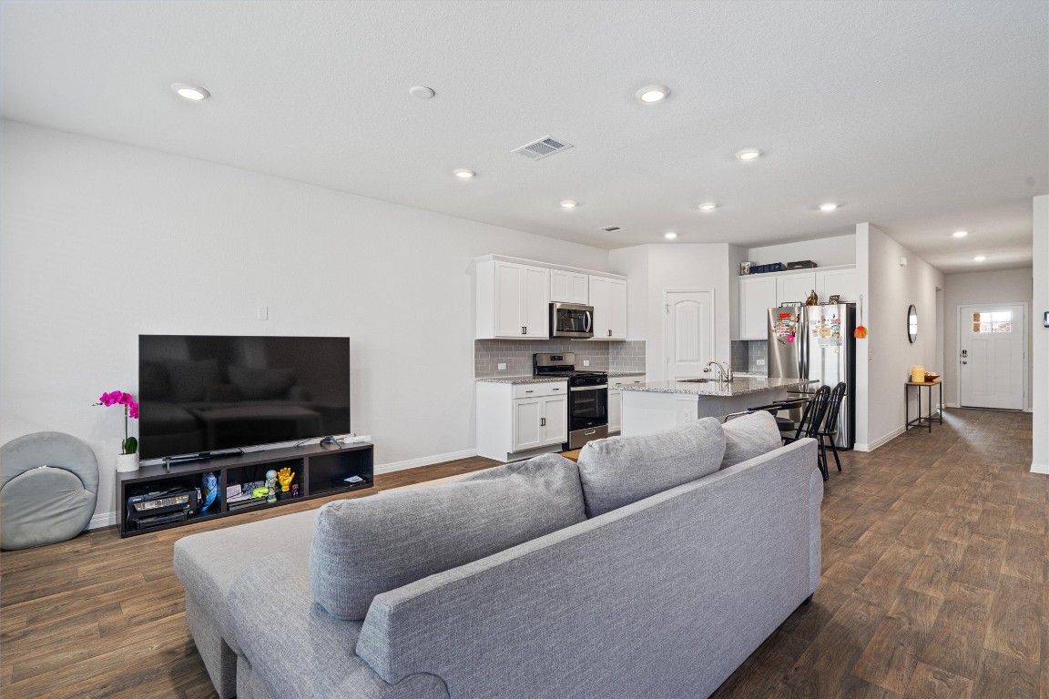 204 Connor Lane Georgetown, TX 78626 - Photo 9 of 31 a living room with furniture and a flat screen tv