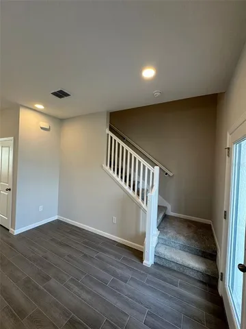 a view of entryway with wooden floor
