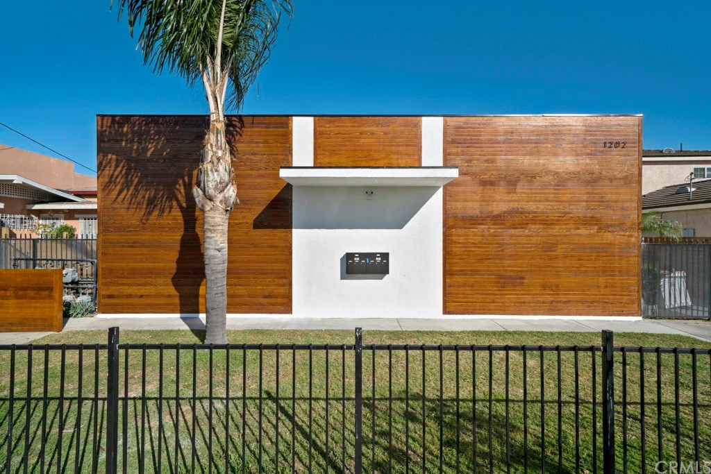 a view of a balcony with a small yard