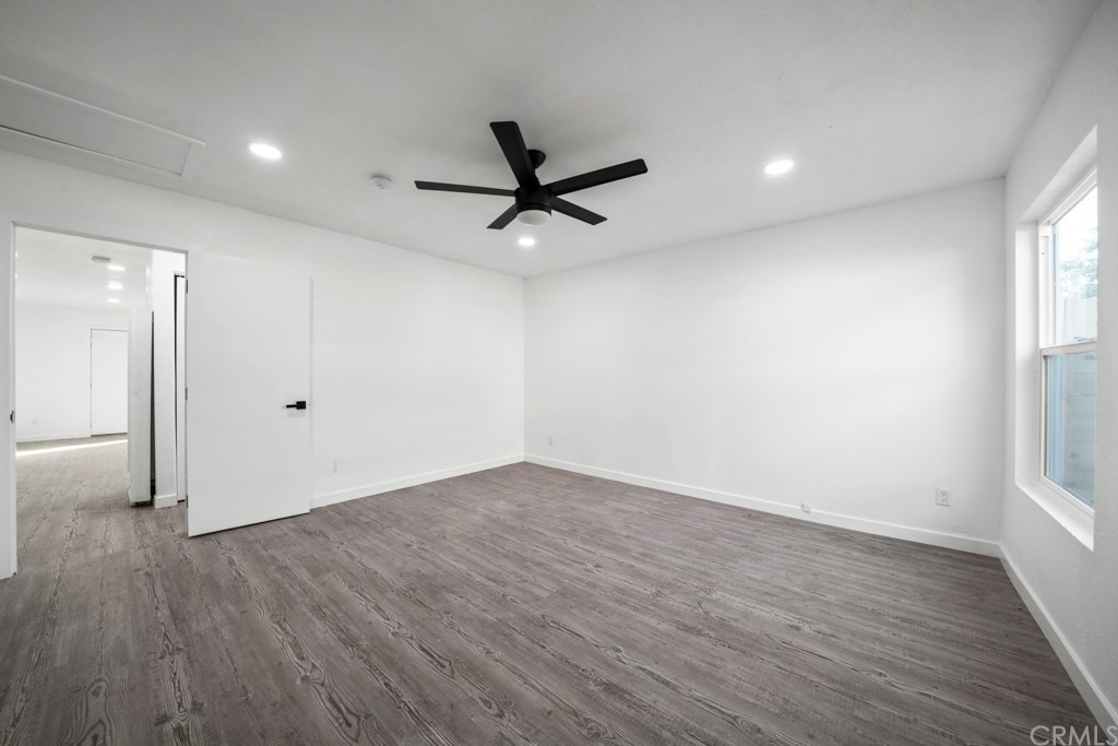 1202 Mahanna Avenue Long Beach, CA 90813 - Photo 15 of 32 an empty room with wooden floor and windows