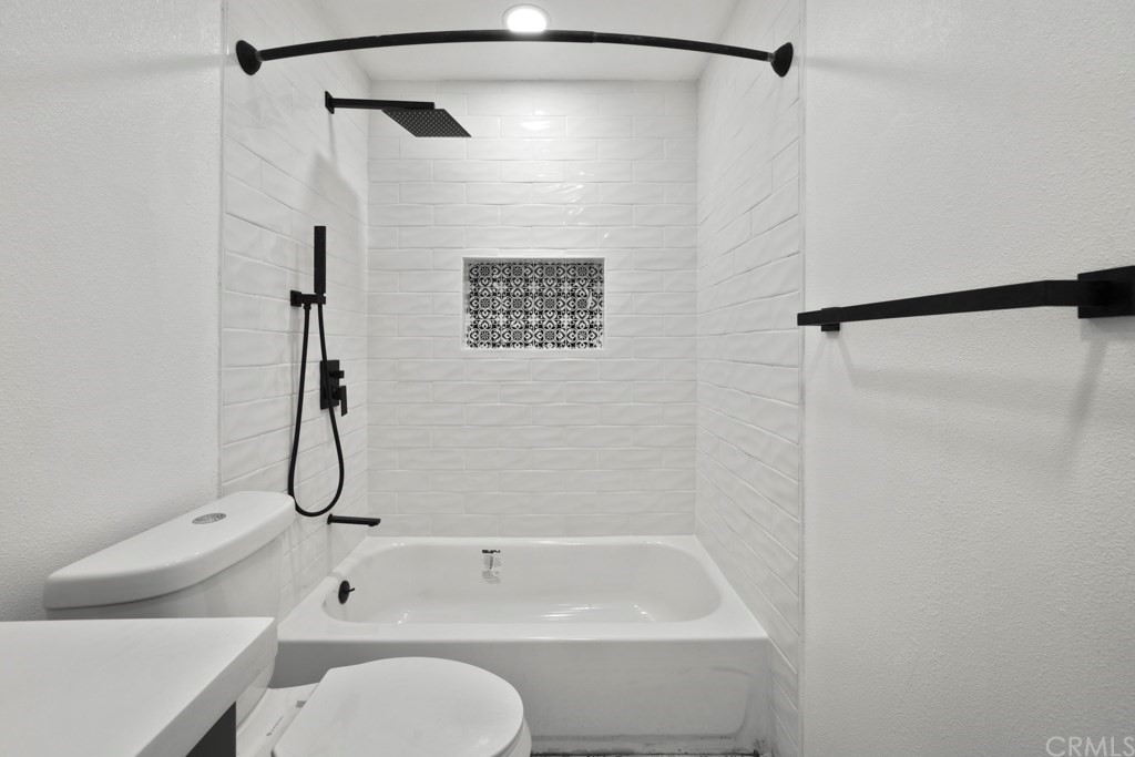 1202 Mahanna Avenue Long Beach, CA 90813 - Photo 17 of 32 a bathroom with a shower and a toilet