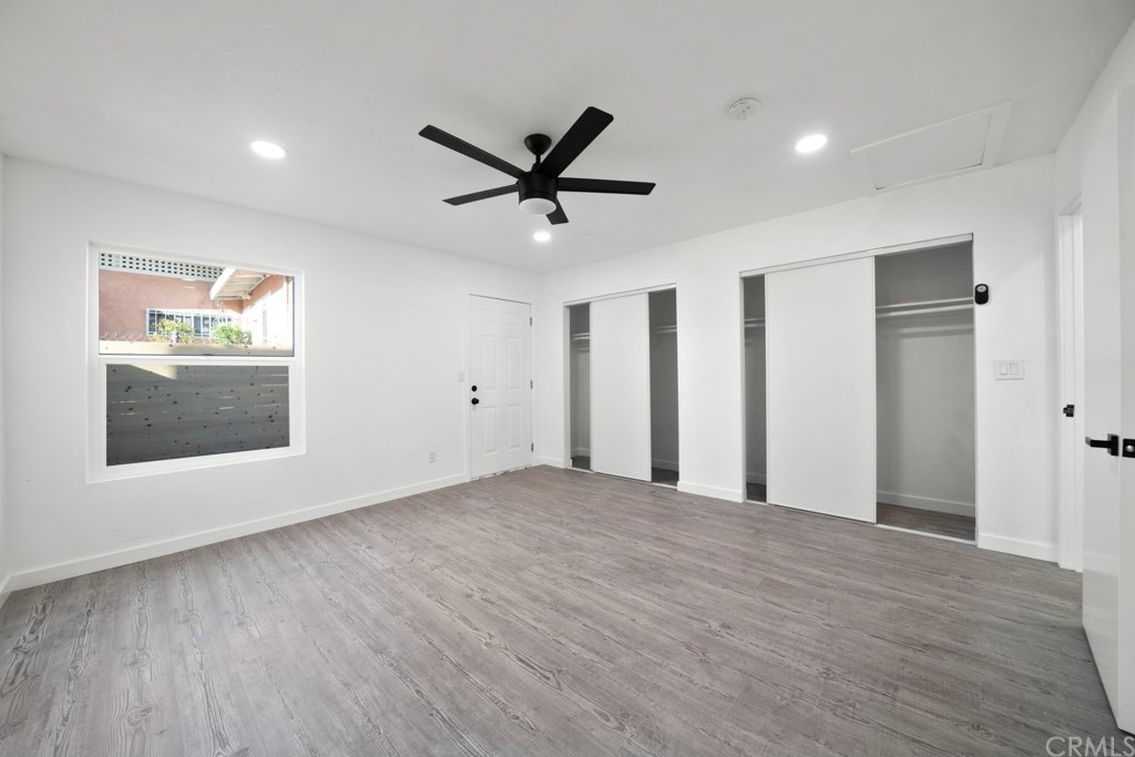 1202 Mahanna Avenue Long Beach, CA 90813 - Photo 24 of 32 a view of an empty room with a window and wooden floor