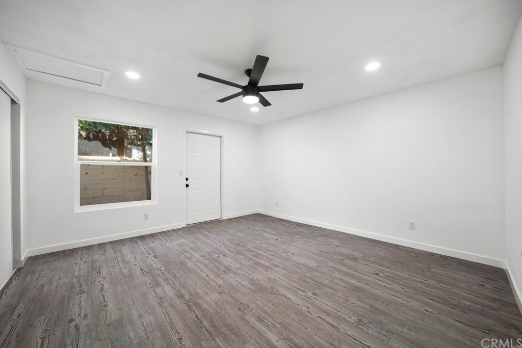 1202 Mahanna Avenue Long Beach, CA 90813 - Photo 25 of 32 an empty room with wooden floor and windows
