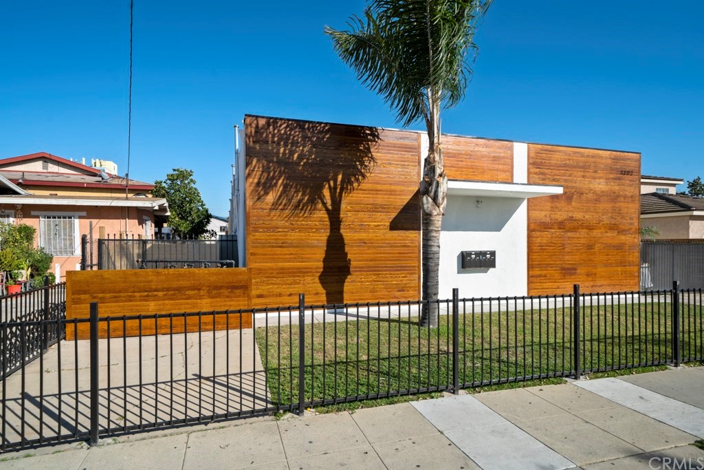 1202 Mahanna Avenue Long Beach, CA 90813 - Photo 27 of 32 a front view of a house having yard