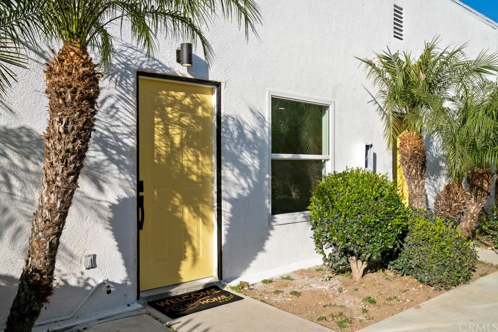 1202 Mahanna Avenue Long Beach, CA 90813 - Photo 4 of 32 a couple of potted plants in front of door