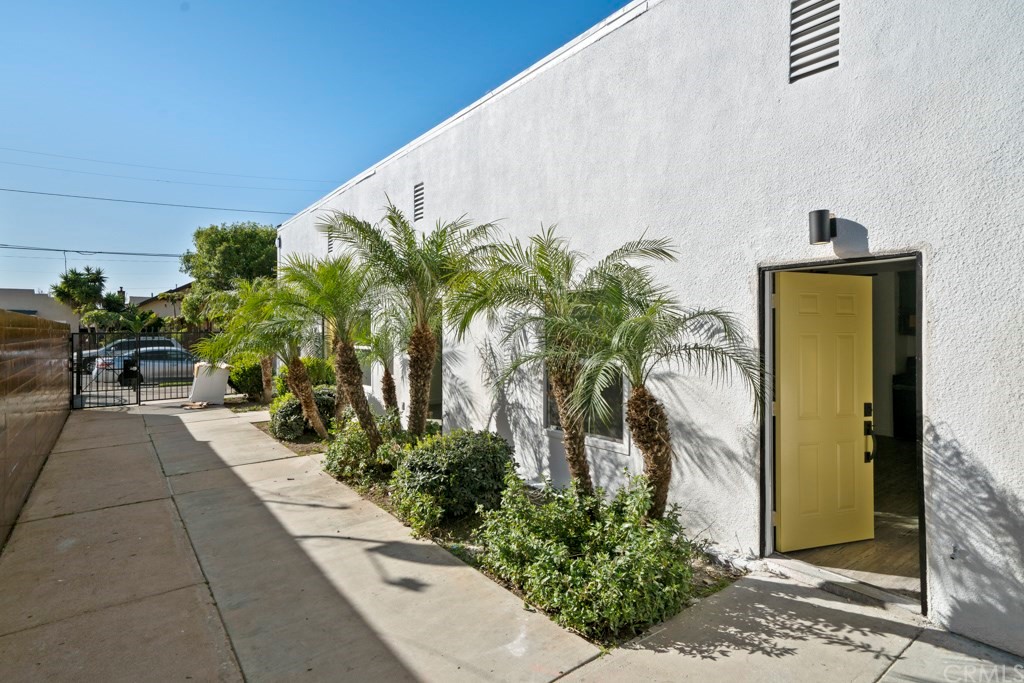 1202 Mahanna Avenue Long Beach, CA 90813 - Photo 7 of 32 a view of a backyard with potted plants