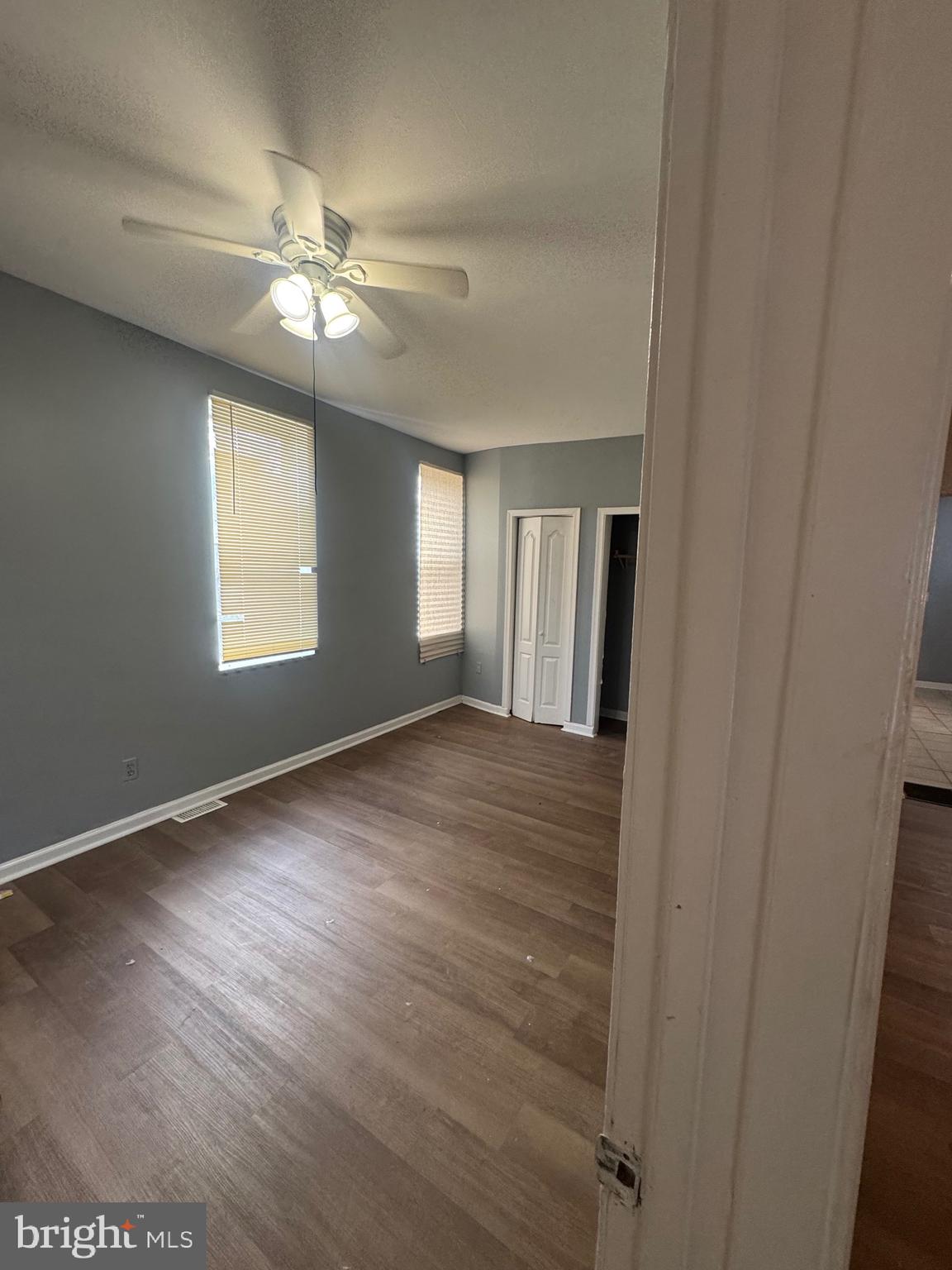 5000 Litchfield Avenue, Unit 1 Baltimore, MD 21215 - Photo 11 of 16 a view of an empty room with wooden floor and a window