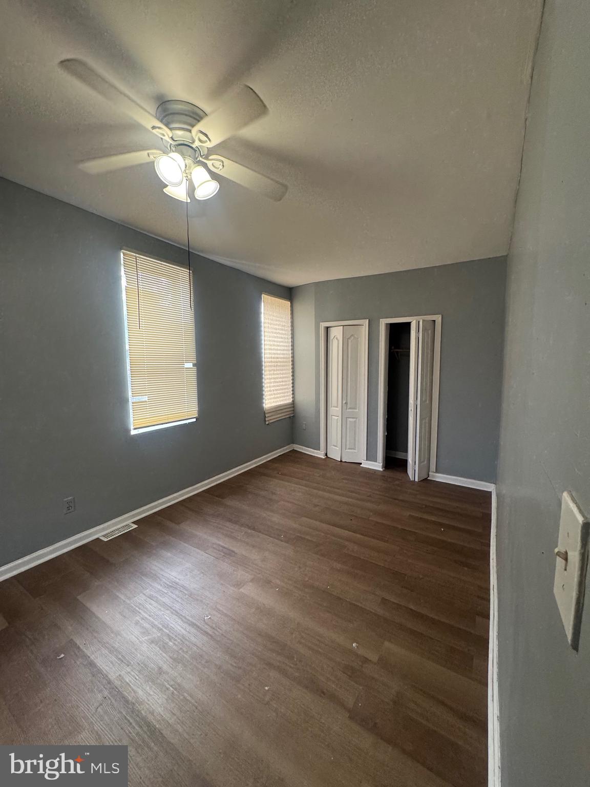 5000 Litchfield Avenue, Unit 1 Baltimore, MD 21215 - Photo 12 of 16 a view of an empty room with window and wooden floor