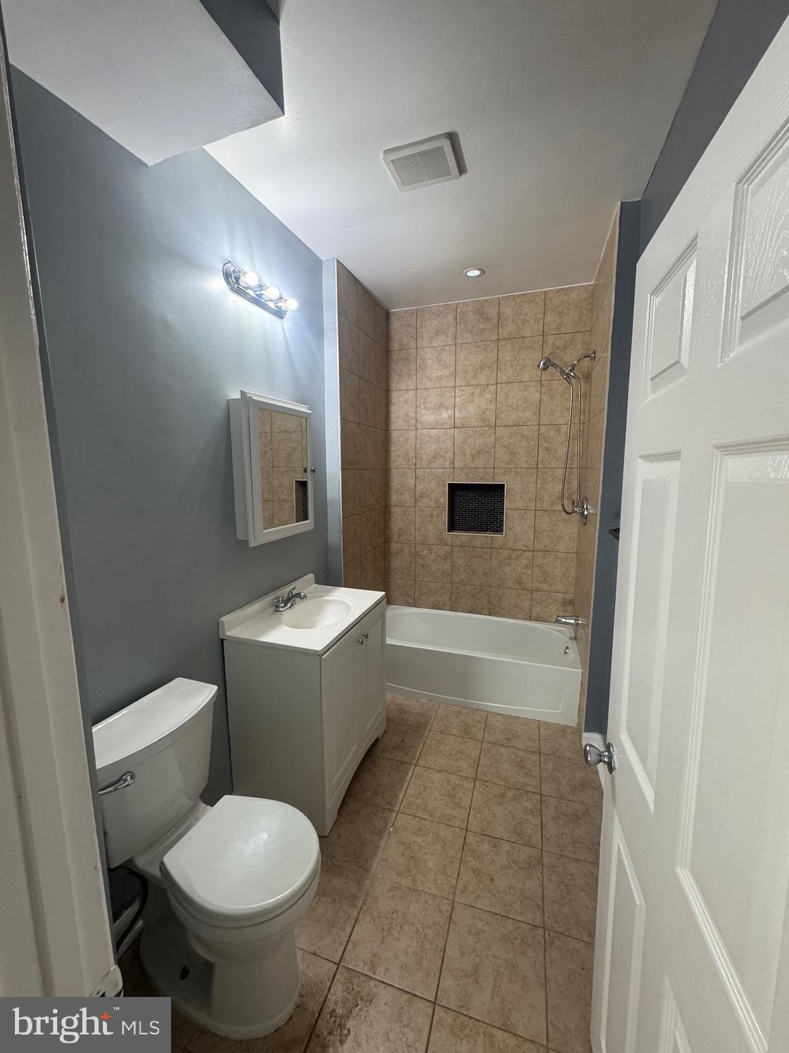 5000 Litchfield Avenue, Unit 1 Baltimore, MD 21215 - Photo 4 of 16 a bathroom with a sink toilet and shower