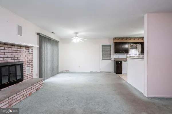 a view of a livingroom with a fireplace