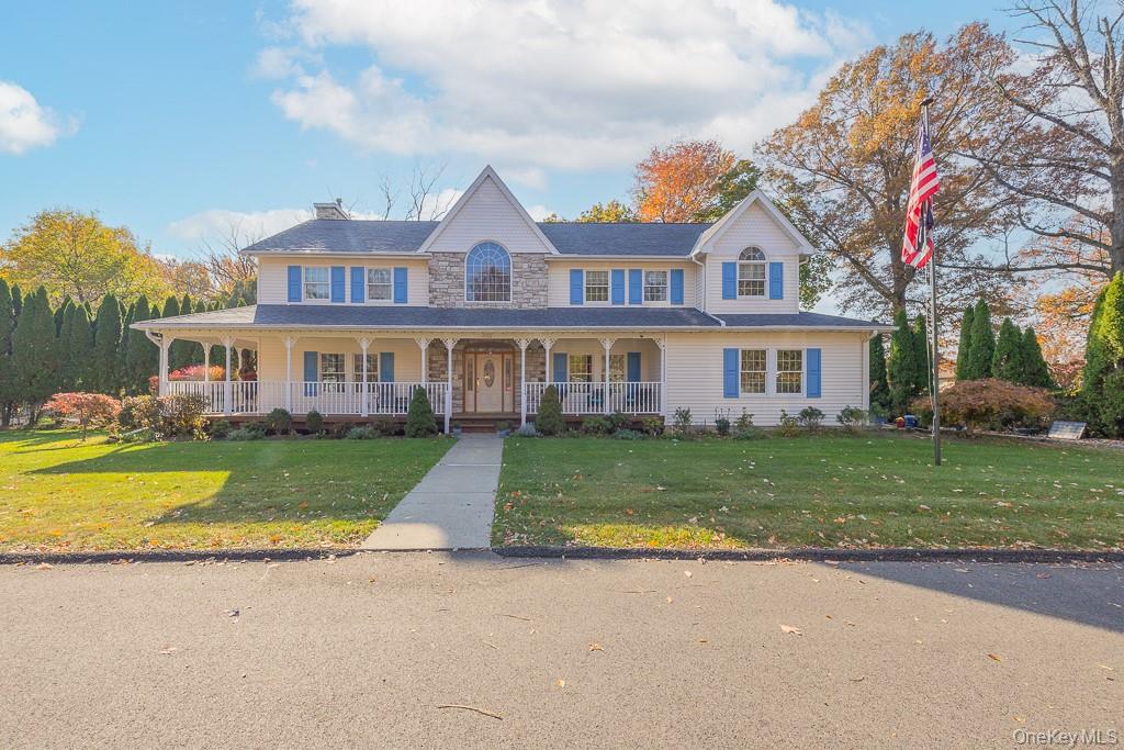 Front of home featuring a wraparound porch