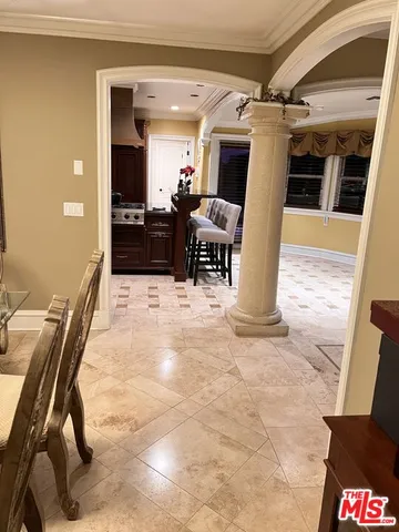 a view of a livingroom with furniture and a ceiling fan