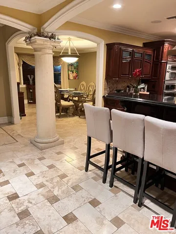 a kitchen with stainless steel appliances granite countertop a stove and a sink