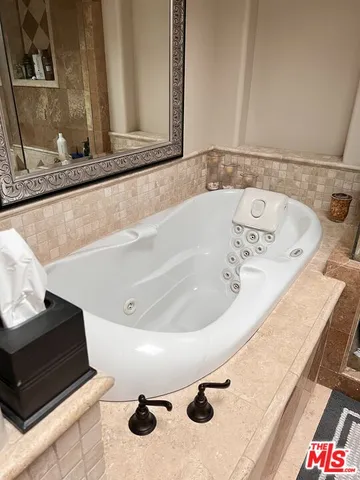 a bedroom with bed and window