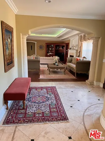 a living room with furniture and a rug