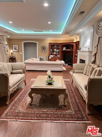 a living room with furniture and a rug