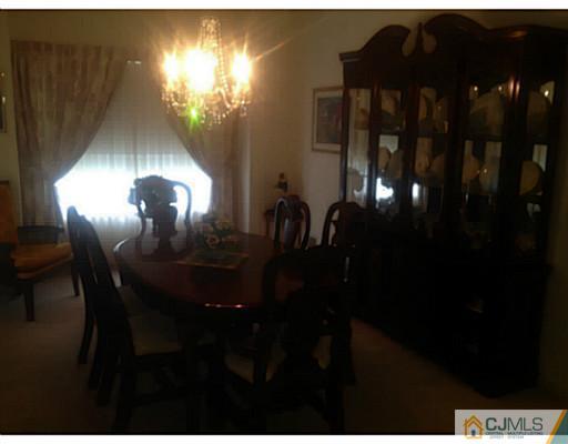 25 Riva Boulevard Brick, NJ 08723 - Photo 2 of 19 a view of a dining room with furniture and chandelier fan
