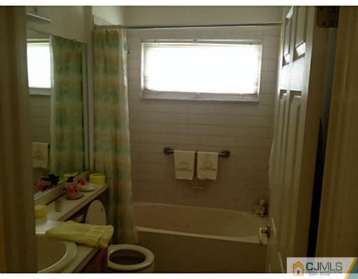 25 Riva Boulevard Brick, NJ 08723 - Photo 15 of 19 a bathroom with a shower