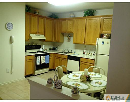 25 Riva Boulevard Brick, NJ 08723 - Photo 4 of 19 a kitchen with a table and chairs