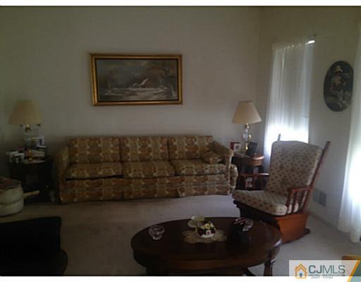 25 Riva Boulevard Brick, NJ 08723 - Photo 8 of 19 a living room with furniture and wooden floor
