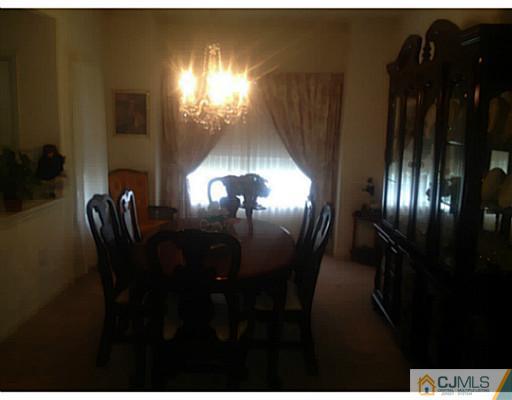 25 Riva Boulevard Brick, NJ 08723 - Photo 10 of 19 a view of a livingroom with furniture and chandelier fan