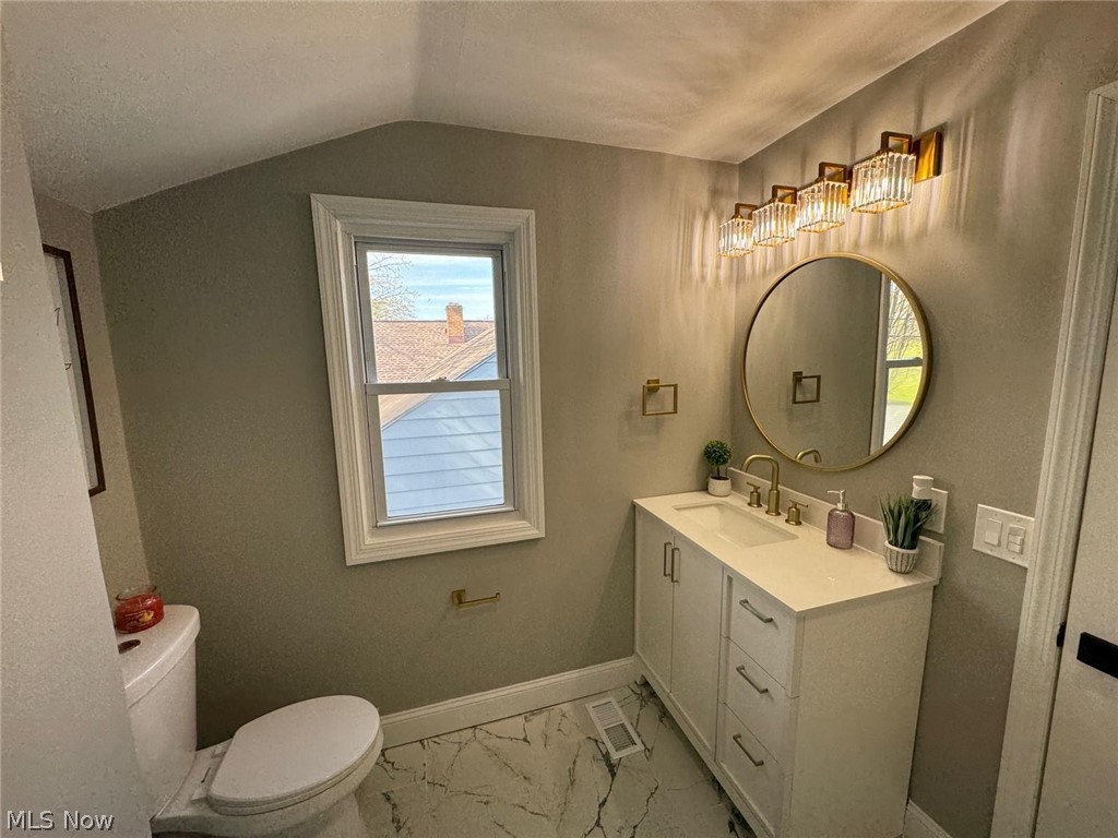 3356 Berea Road Cleveland, OH 44111 - Photo 25 of 35 Bathroom featuring toilet, tile floors, vanity, and lofted ceiling