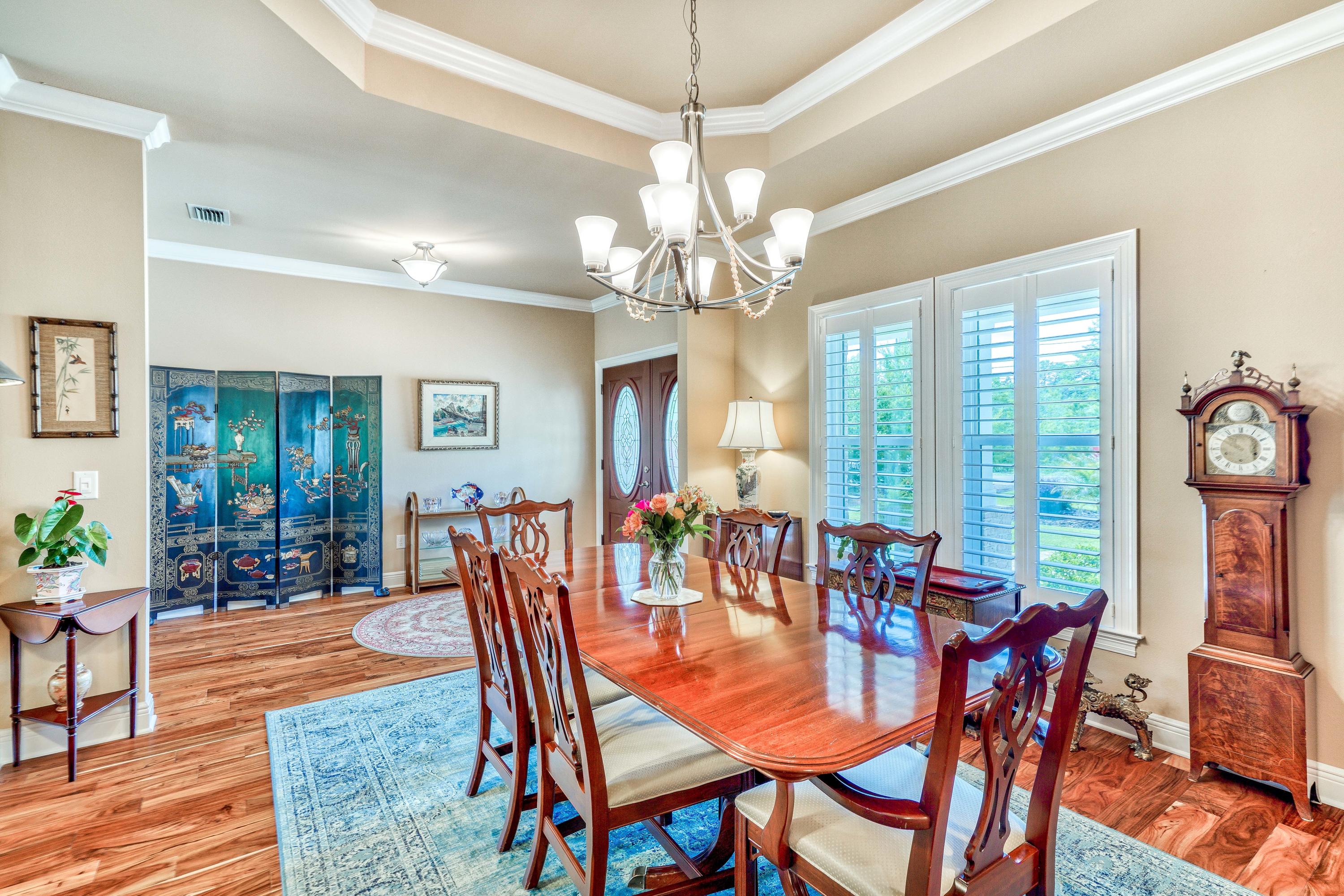 488 Ridge Road Santa Rosa Beach, FL 32459 - Photo 13 of 46 a view of a dining room with furniture window and wooden floor