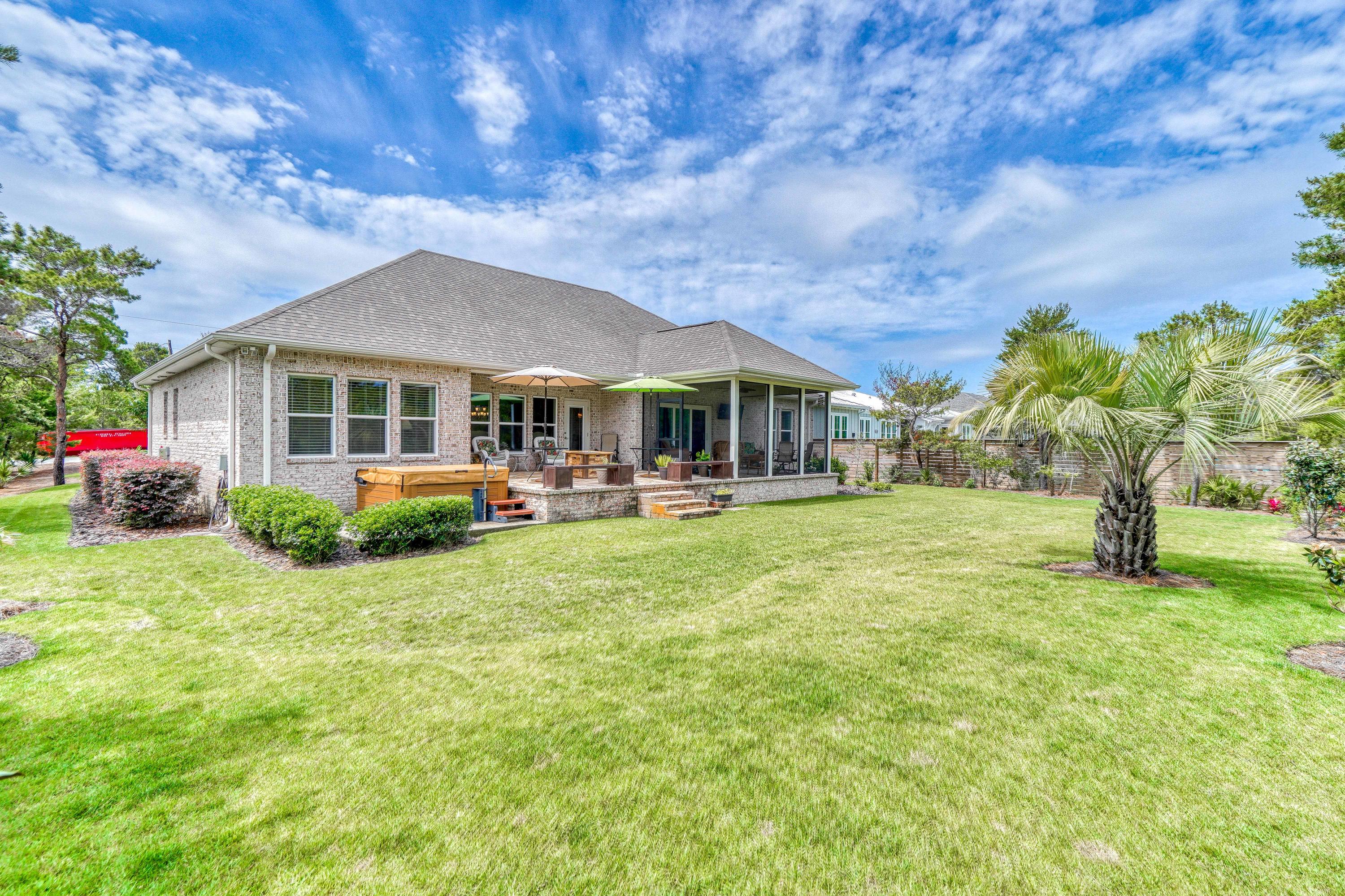 488 Ridge Road Santa Rosa Beach, FL 32459 - Photo 38 of 46 a front view of a house with a yard table and chairs